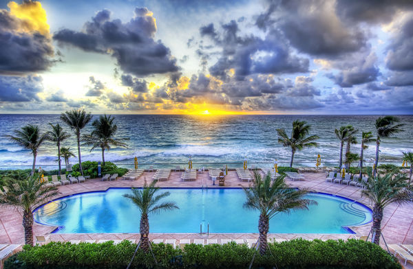 There's a pool party at sunset - everyone mark your chair with a towel